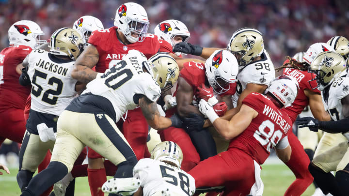 Aug 10, 2024; Glendale, Arizona, USA; Arizona Cardinals running back Trey Benson (33) against the New Orleans Saints during a preseason NFL game at State Farm Stadium. Mandatory Credit: Mark J. Rebilas-USA TODAY Sports