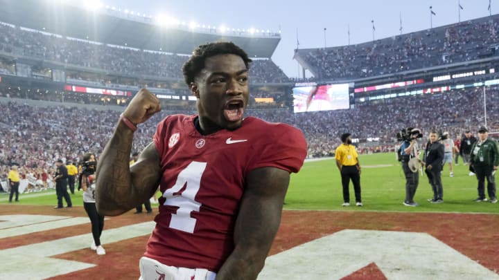 Oct 21, 2023; Tuscaloosa, Alabama, USA;  Alabama Crimson Tide quarterback Jalen Milroe (4) celebrates with fans after the Crimson Tide defeated Tennessee 34-20 at Bryant-Denny Stadium. Mandatory Credit: Gary Cosby Jr.-USA TODAY Sports