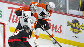 Oct 23, 2025; Ottawa, Ontario, CAN; Ottawa Senators center Tim Stutzle (18) moves in on Philadelphia Flyers goalie Dan Vladar (80) and defenseman Travis Sanheim (6) who controls the puck in the third period at the Canadian Tire Centre. Mandatory Credit: Marc DesRosiers-IMAGN Images