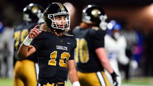 Oct 20, 2023; Carrollton, GA, USA; Carrollton Trojans quarterback Julian Lewis (10) looks for the play call against the Westl