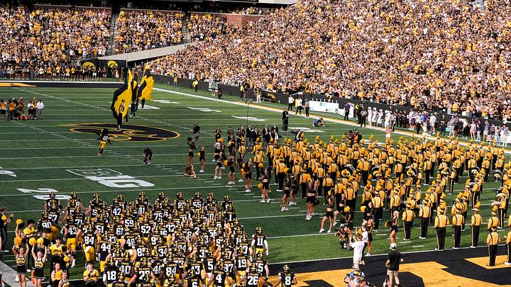 The Iowa Hawkeyes team takes the field against the Albany Great Danes during the Swarm Aug. 30, 2025 at Kinnick Stadium in Iowa City, Iowa.