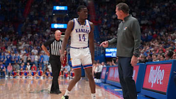 Kansas Jayhawks guard Melvin Council Jr. (14) talks to Kansas Jayhawks head coach Bill Self during the second half of the exhibition game against Fort Hays State Tigers inside Allen Fieldhouse on Tuesday, October, 28, 2025.