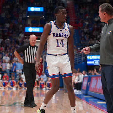Kansas Jayhawks guard Melvin Council Jr. (14) talks to Kansas Jayhawks head coach Bill Self during the second half of the exhibition game against Fort Hays State Tigers inside Allen Fieldhouse on Tuesday, October, 28, 2025.