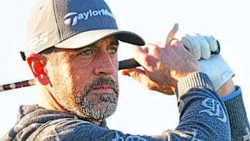 Jets quarterback Aaron Rodgers tees off on the first hole during the Phoenix Open Annexus Pro-Am at TPC Scottsdale on February 5, 2025.