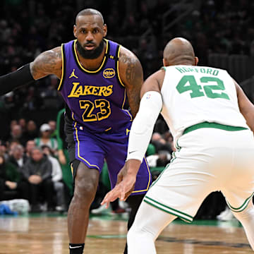 Mar 8, 2025; Boston, Massachusetts, USA; Los Angeles Lakers forward LeBron James (23) controls the ball against Boston Celtics center Al Horford (42) during the third quarter at the TD Garden. Mandatory Credit: Brian Fluharty-Imagn Images