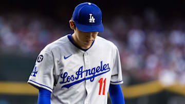 May 9, 2025; Phoenix, Arizona, USA; Los Angeles Dodgers pitcher Roki Sasaki (11) reacts against the Arizona Diamondbacks at Chase Field. Mandatory Credit: Mark J. Rebilas-Imagn Images