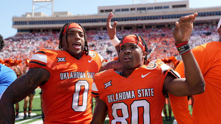 Oklahoma State's Ollie Gordon II (0) and Brennan Presley (80) celebrate following the college football game between the Oklahoma State Cowboys and the Arkansas Razorbacks at Boone Pickens Stadium in Stillwater, Okla.,, Saturday, Sept., 7, 2024.