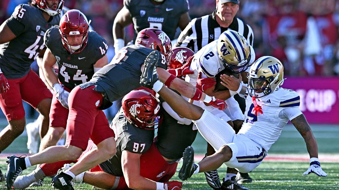 Sep 20, 2025; Pullman, Washington, USA; Washington Huskies quarterback Demond Williams Jr. (2) is stopped by Washington State Cougars linebacker Caleb Francl (9) and Washington State Cougars defensive tackle Max Baloun (97) in the first half of Apple Cup at Gesa Field at Martin Stadium.