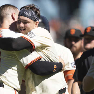 Sep 5, 2024; San Francisco, California, USA;  San Francisco Giants catcher Patrick Bailey (14) hugs third base Matt Chapman (26) after defeating the Arizona Diamondbacks at Oracle Park.