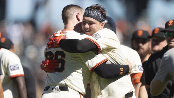 Sep 5, 2024; San Francisco, California, USA;  San Francisco Giants catcher Patrick Bailey (14) hugs third base Matt Chapman (26) after defeating the Arizona Diamondbacks at Oracle Park.