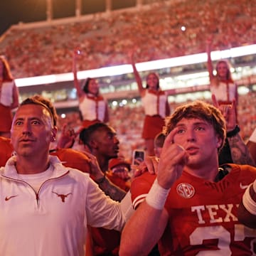 Sep 14, 2024; Austin, Texas, USA; Texas Longhorns head coach Steve Sarkisian stands for the Eyes of Texas with players and fans after a victory over the Texas-San Antonio Roadrunners at Darrell K Royal-Texas Memorial Stadium. Mandatory Credit: Scott Wachter-Imagn Images