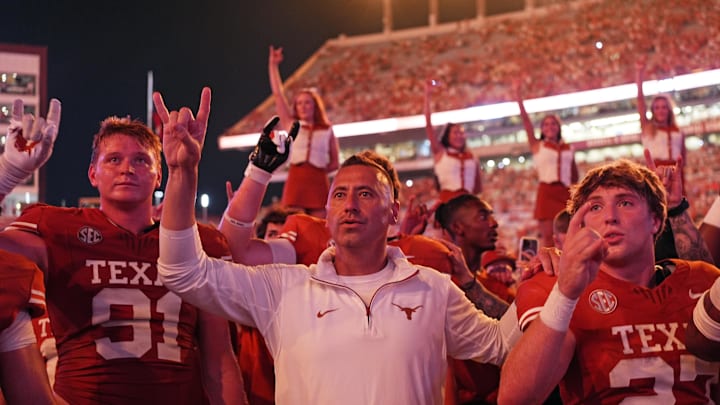 Sep 14, 2024; Austin, Texas, USA; Texas Longhorns head coach Steve Sarkisian stands for the Eyes of Texas with players and fans after a victory over the Texas-San Antonio Roadrunners at Darrell K Royal-Texas Memorial Stadium. Mandatory Credit: Scott Wachter-Imagn Images