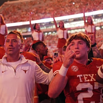 Sep 14, 2024; Austin, Texas, USA; Texas Longhorns head coach Steve Sarkisian stands for the Eyes of Texas with players and fans after a victory over the Texas-San Antonio Roadrunners at Darrell K Royal-Texas Memorial Stadium. Mandatory Credit: Scott Wachter-Imagn Images