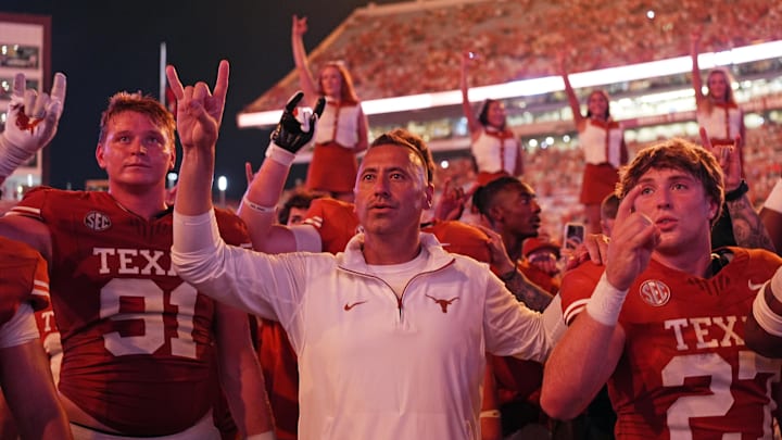 Sep 14, 2024; Austin, Texas, USA; Texas Longhorns head coach Steve Sarkisian stands for the Eyes of Texas with players and fans after a victory over the Texas-San Antonio Roadrunners at Darrell K Royal-Texas Memorial Stadium. Mandatory Credit: Scott Wachter-Imagn Images