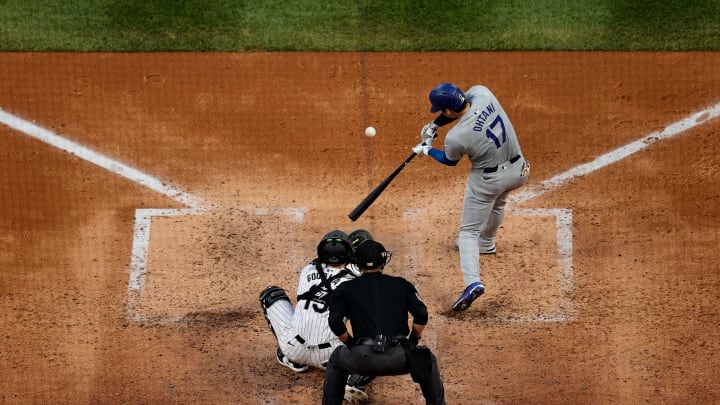 Jun 18, 2024; Denver, Colorado, USA; Los Angeles Dodgers designated hitter Shohei Ohtani (17) hits a solo home run in the sixth inning against the Colorado Rockies at Coors Field. Mandatory Credit: Isaiah J. Downing-USA TODAY Sports