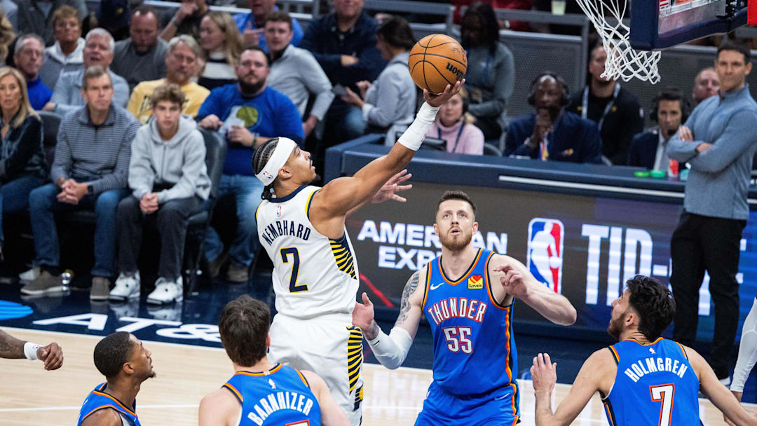 Oct 23, 2025; Indianapolis, Indiana, USA; Indiana Pacers guard Andrew Nembhard (2) shoots the ball while Oklahoma City Thunder center Isaiah Hartenstein (55) defends in the first half at Gainbridge Fieldhouse. Mandatory Credit: Trevor Ruszkowski-Imagn Images