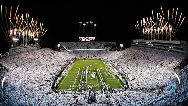 Fireworks burst overhead as the Penn State Nittany Lions take the field prior to a White Out game