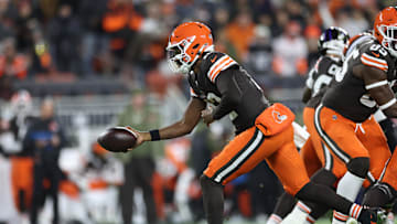 Nov 16, 2025; Cleveland, Ohio, USA; Cleveland Browns quarterback Shedeur Sanders (12) hands the ball off during the third quarter against the Baltimore Ravens at Huntington Bank Field. Mandatory Credit: Scott Galvin-Imagn Images