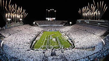 Fireworks burst overhead as the Penn State Nittany Lions take the field prior to a White Out game against the Washington Huskies at Beaver Stadium.