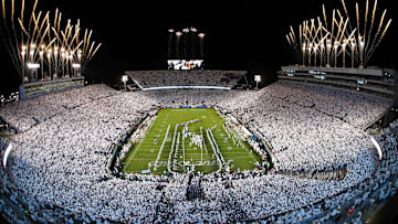 Fireworks burst overhead as the Penn State Nittany Lions take the field