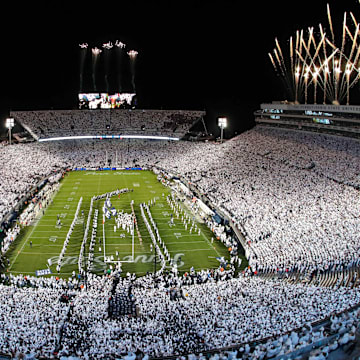 Fireworks burst over Beaver Stadium as the Penn State Nittany Lions take the field prior to the 2024 "White Out" game against the Washington Huskies. 