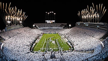 Nov 9, 2024; University Park, Pennsylvania, USA; Fireworks burst overhead as the Penn State Nittany Lions take the field prior to a White Out game against the Washington Huskies at Beaver Stadium. Mandatory Credit: Matthew O'Haren-Imagn Images