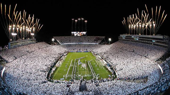 Nov 9, 2024; University Park, Pennsylvania, USA; Fireworks burst overhead as the Penn State Nittany Lions take the field prior to a White Out game against the Washington Huskies at Beaver Stadium. Mandatory Credit: Matthew O'Haren-Imagn Images