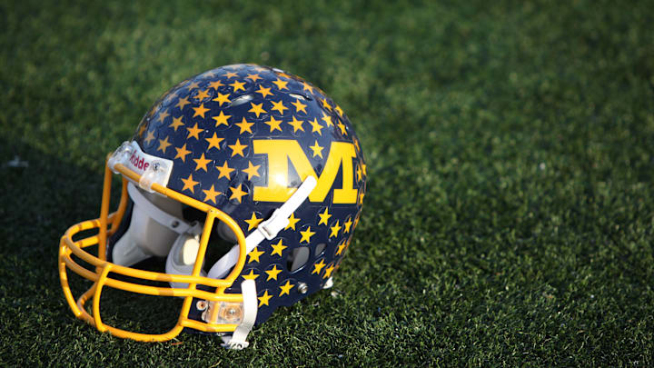 A vintage Crusaders' football helmet sits on the Michael A. Stofko Memorial Field at Archbishop Moeller High School