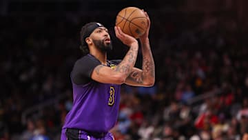 Dec 6, 2024; Atlanta, Georgia, USA; Los Angeles Lakers forward Anthony Davis (3) shoots a free throw against the Atlanta Hawks in the second quarter at State Farm Arena. Mandatory Credit: Brett Davis-Imagn Images