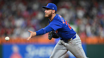 Sep 24, 2024; Philadelphia, Pennsylvania, USA; Chicago Cubs infielder Cody Bellinger (24) flips to first base against the Philadelphia Phillies in the third inning at Citizens Bank Park.