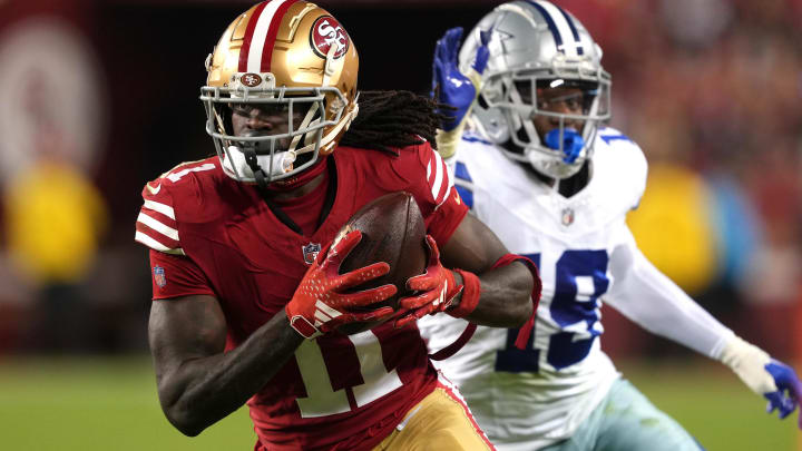 Oct 8, 2023; Santa Clara, California, USA; San Francisco 49ers wide receiver Brandon Aiyuk (11) runs after a catch against Dallas Cowboys cornerback Noah Igbinoghene (19) during the third quarter at Levi's Stadium.