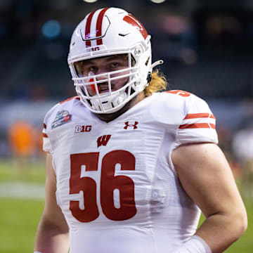 Dec 27, 2022; Phoenix, Arizona, USA; Wisconsin Badgers offensive lineman Joe Brunner (56) against the Oklahoma State Cowboys during the 2022 Guaranteed Rate Bowl at Chase Field.
