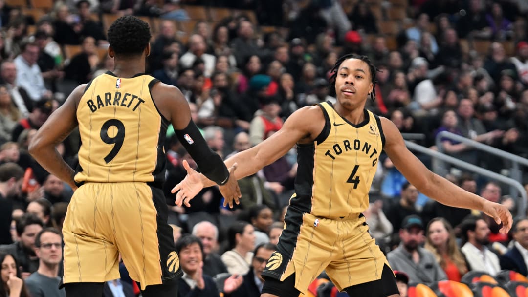 Feb 22, 2024; Toronto, Ontario, CAN;  Toronto Raptors forward Scottie Barnes (4) slaps hands with forward RJ Barrett (9) after scoring against the Brooklyn Nets in the first half at Scotiabank Arena. Mandatory Credit: Dan Hamilton-USA TODAY Sports