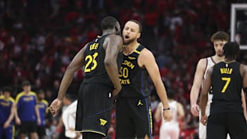 May 4, 2025; Houston, Texas, USA; Golden State Warriors guard Stephen Curry (30) celebrates with forward Draymond Green (23) after a play during game seven of the first round for the 2025 NBA Playoffs against the Houston Rockets at Toyota Center. Mandatory Credit: Troy Taormina-Imagn Images