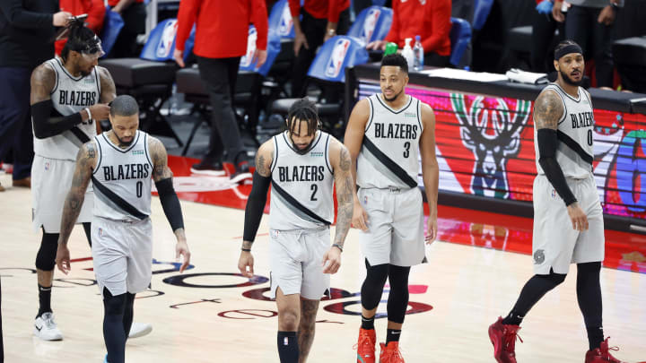 Mar 16, 2021; Portland, Oregon, USA; Portland Trail Blazers (from left to right) Robert Covington (23), Damian Lillard (0), Gary Trent Jr. (2), CJ McCollum (3), and Carmelo Anthony (00) walk back to the court after a timeout during the second half against the New Orleans Pelicans at Moda Center. Mandatory Credit: Soobum Im-USA TODAY Sports