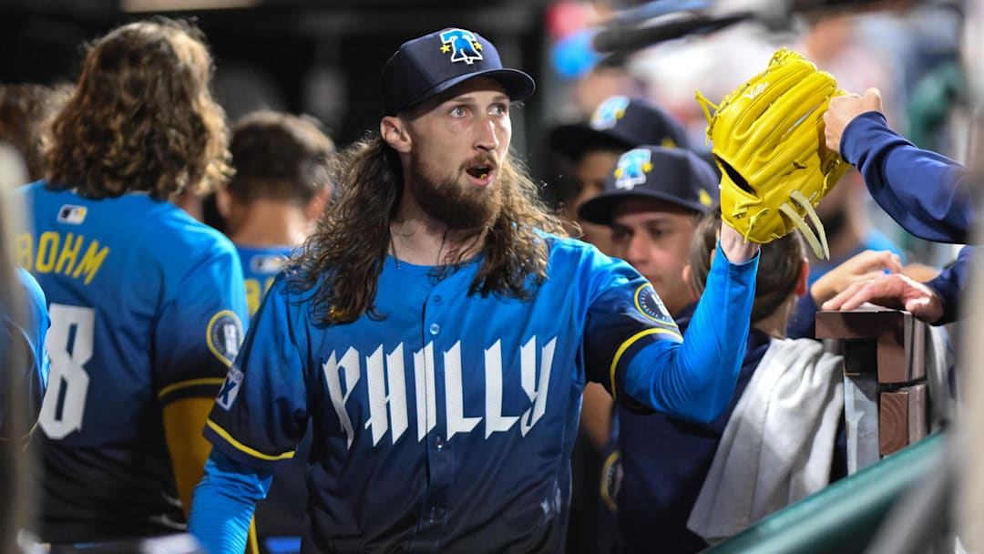 Aug 22, 2025; Philadelphia, Pennsylvania, USA; Philadelphia Phillies pitcher Matt Strahm (25) is greeted by teammates in the dugout after the seventh inning against the Washington Nationals at Citizens Bank Park. Mandatory Credit: John Jones-Imagn Images