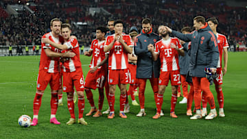 Bayern Munich players celebrating after win against VfB Stuttgart.