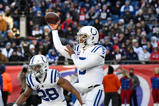 Indianapolis Colts quarterback Anthony Richardson (5) throws a pass in a white jersey.
