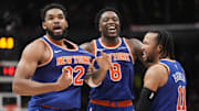 Dec 9, 2024; Toronto, Ontario, CAN; New York  Knicks guard Jalen Brunson (11) and forward OG Anunoby (8) react after a three point basket by center Karl-Anthony Towns (32) to clinch a win over the Toronto Raptors during the second half at Scotiabank Arena. Mandatory Credit: John E. Sokolowski-Imagn Images