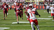 Nov 1, 2025; Blacksburg, Virginia, USA;  Louisville Cardinals running back Isaac Brown (1) runs the ball for a touchdown against the Virginia Tech Hokies during the first quarter at Lane Stadium. Mandatory Credit: Brian Bishop-Imagn Images