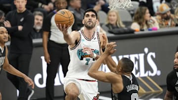 Jan 15, 2025; San Antonio, Texas, USA; mg Memphis Grizzlies forward Santi Aldama (7) drives to the basket against San Antonio Spurs forward Keldon Johnson (0) during the first half at Frost Bank Center. Mandatory Credit: Scott Wachter-Imagn Images