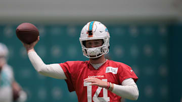 Jul 23, 2025; Miami Gardens, FL, USA; Miami Dolphins quarterback Quinn Ewers (14) throws the football during training camp at Baptist Health Training Complex. 
