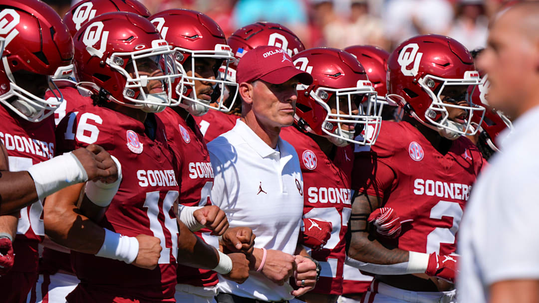 Oklahoma coach Brent Venables locks arms with his team before the Red River Rivalry college football game between the University of Oklahoma Sooners (OU) and the Texas Longhorns at the Cotton Bowl in Dallas, Saturday, Oct. 12, 2024.
