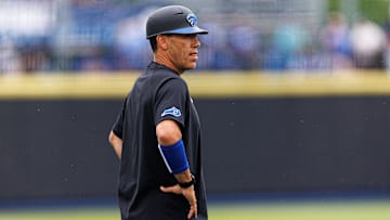 Jun 1, 2024; Lexington, KY, USA; Kentucky Wildcats head coach Nick Mingione stands on the field before a game against the Illinois Fighting Illini at Kentucky Proud Park. Mandatory Credit: Jordan Prather-Imagn Images