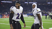 Baltimore Ravens running back Derrick Henry and quarterback Lamar Jackson smile after the game against the Houston Texans.