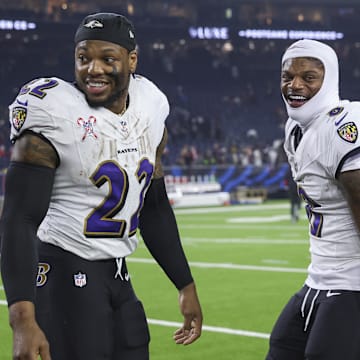Dec 25, 2024; Houston, Texas, USA;  Baltimore Ravens running back Derrick Henry (22) and quarterback Lamar Jackson (8) smile after the game against the Houston Texans at NRG Stadium. Mandatory Credit: Troy Taormina-Imagn Images