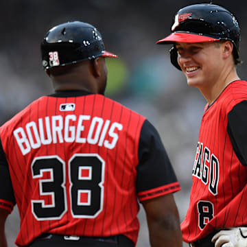 Jun 6, 2025; Chicago, Illinois, USA; Chicago White Sox catcher Kyle Teel (8) celebrates his single for his first MLB hit in his debut with first base coach Jason Bourgeois (38) during the fourth inning against the Kansas City Royals at Rate Field. Mandatory Credit: Patrick Gorski-Imagn Images