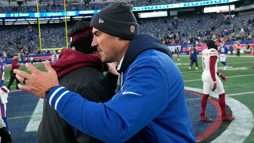 New York Giants Head Coach, Mike Kafka hugs Washington Commanders head coach, Dan Quinn, after the game, Sunday, December 14, 2025. The Commanders were victorious in East Rutherford, 29-21.
