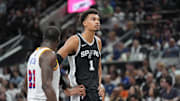 Nov 23, 2024; San Antonio, Texas, USA;  San Antonio Spurs center Victor Wembanyama (1) looks up in front of Golden State Warriors forward Draymond Green (23) in the first half at Frost Bank Center. Mandatory Credit: Daniel Dunn-Imagn Images