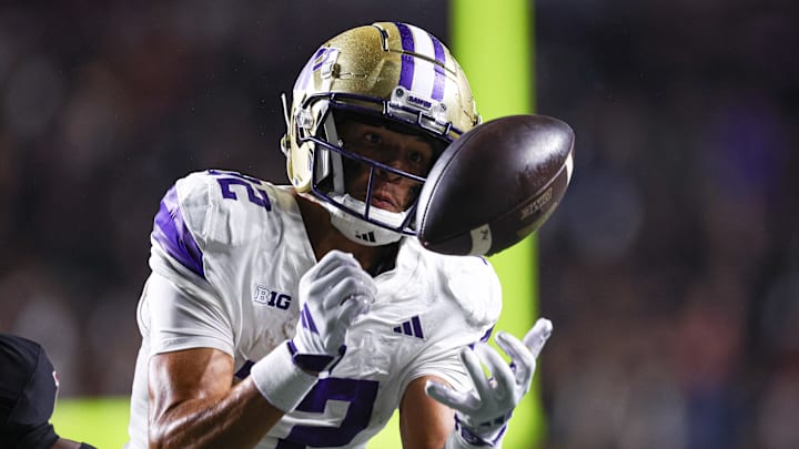 Sep 27, 2024; Piscataway, New Jersey, USA; Washington Huskies wide receiver Denzel Boston (12) bobbles the ball before making a catch during the second half against the Rutgers Scarlet Knights at SHI Stadium. Mandatory Credit: Vincent Carchietta-Imagn Images